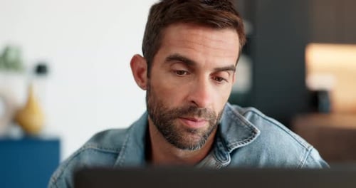 Man Thinking While Looking at Computer Screen