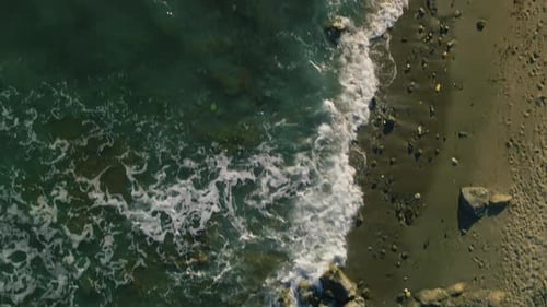 High angle view of waves on the beach