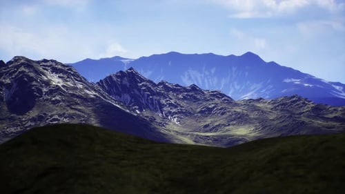 Majestic Mountain Landscape with Rolling Hills Under a Clear Sky
