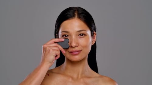 Woman Massaging Her Face for Skincare