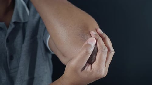 Young Man Suffering Pain on Elbow
