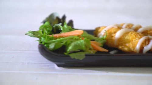 Delicious Tempura Shrimp with Salad on Plate