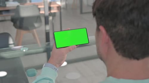 Holding Phone with Green Screen Chroma Key
