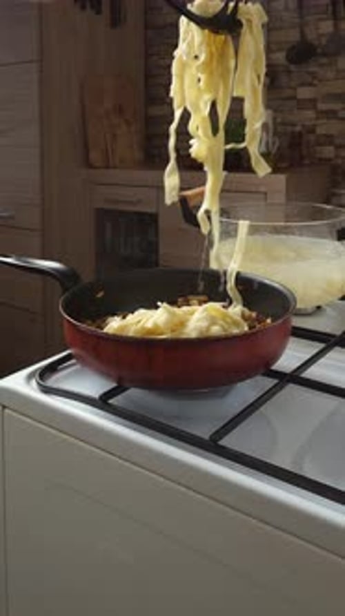 Put Pasta In The Pan With Sauteed Mushrooms And Onions