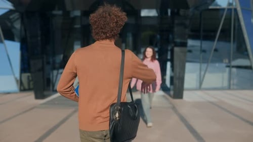 Teenagers Greet and Smile with Cheerful Energy at University Campus