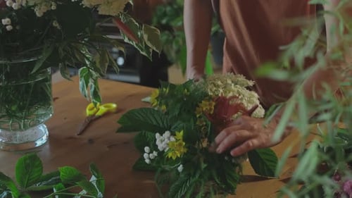 Flower Shop Florist Hands Making Bouquet of Fresh Flowers