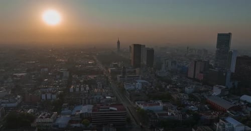 Beautiful aerial hyperlapse view of modern urban Mexico City, at sunset