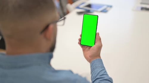 Hispanic Using Phone with Green Screen