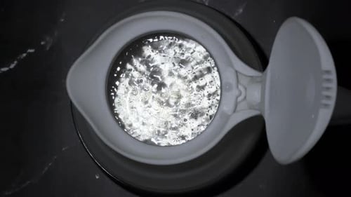 boiling water bubbles comes up in silicone kettle closeup top view