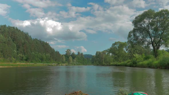 View on the calm river of Dunajec from inside the raft in Polish ...