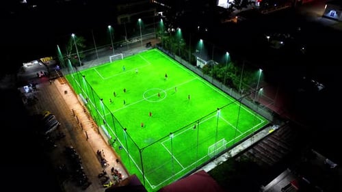 Aerial view of mini football match, soccer. MiniFootball field and Footballers from drone