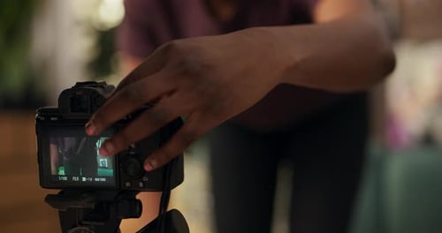 Woman Recording Video With Camera Indoors