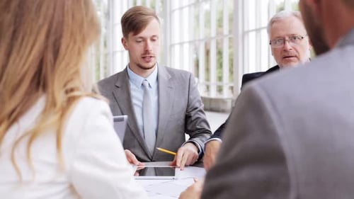 Business Team Discussing Ideas in Bright Meeting Room