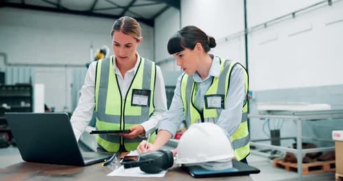 Tablet, laptop and team of women engineers with research for maintenance