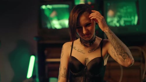 Freaky Woman with Tattoos on Body and Piercing on Face in Studio Portrait Smiling Lady in