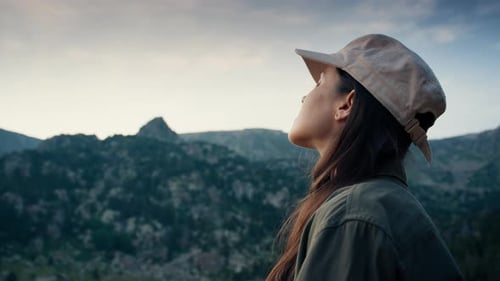 Female Tourist Portrait on Mountain Landscape Enjoys Beautiful Sunset View