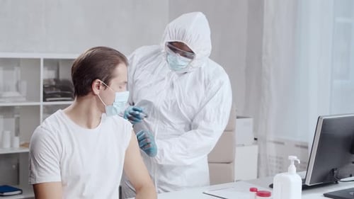 Vaccine Injection Given by Healthcare Worker in Office
