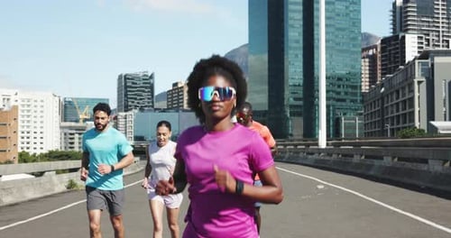 Fitness, woman and people with running in city for marathon practice, pace training and endurance