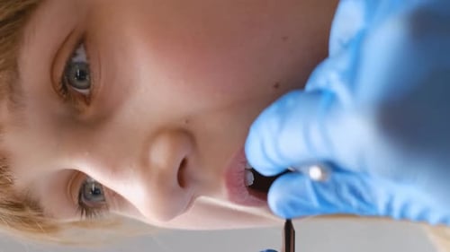 Child Receiving a Dental Exam Close-Up