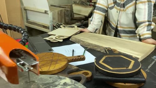 Woman working with Jigsaw in Wood Shop