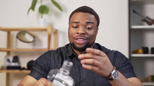 Attractive charismatic black man rinses his mouth