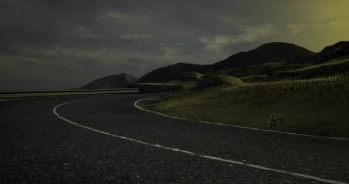 Winding Road Through Tranquil Hills Under a Twilight Sky Invites Adventure