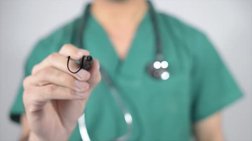 Adult Writes Word Urologist on Glass Surface