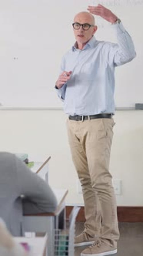 Teacher Explaining Lesson in Classroom