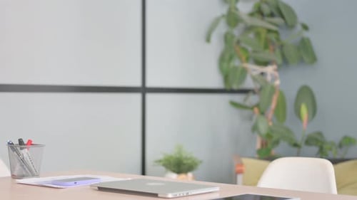 Businessman Coming to Office and Starting Work on Laptop