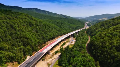Long freeway is being built along the spectacular mountains.