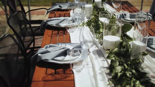 Bride and Groom Place Settings at Wedding Reception Table Beautiful Plates with a Gold Border on a