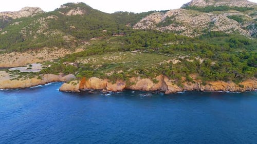 Secluded picturesque ocean coastline, Balearic Islands shoreline, aerial