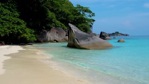 White Beach and Turqouse Colored Ocean with Big Boulders in Ocean at Similan Islands Thailand