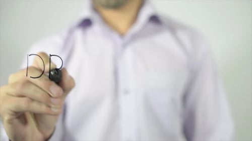 Man Writes 'Dream Big' on Glass Screen