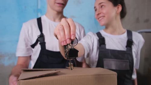 Own Home Mortgage Relocation Concept Happy Couple Holding Key From New First House Family