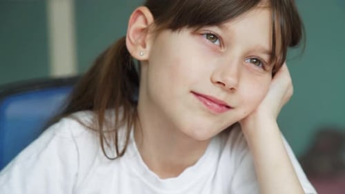 Pensive Child with Head in Hand Close Up