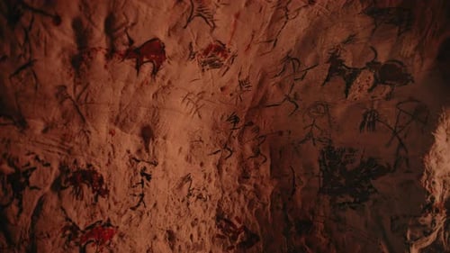 Cave Paintings of Animals and Humans on Rock Wall