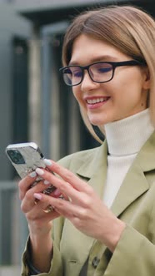 Portrait Beautiful Businesswoman Wearing Smart Casual Clothes Using Smartphone on Urban Street