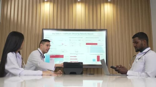 Medical Colleagues Analyzing Data in Conference Room
