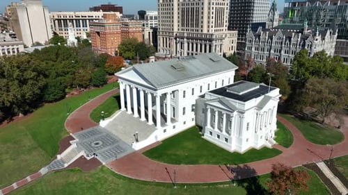 Virginia state capitol building in downtown Richmond, VA. Aerial descending shot towards ornate whit