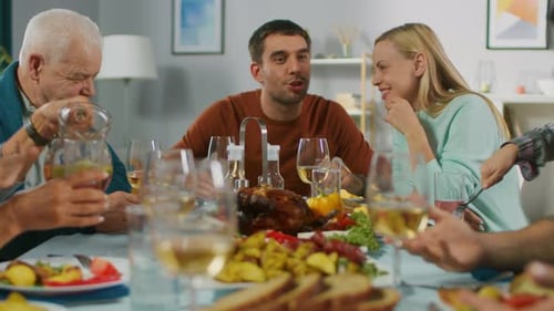 Multi-generational family enjoying a festive meal together at home