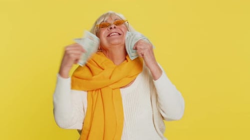 Senior Old Winner Woman Holding Fan of Cash Money Dollar Banknotes Celebrate Dance Success Pension