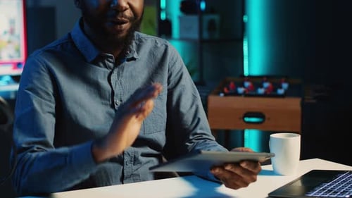 Adult with Tablet Engaged in Video Call