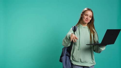 Young Woman Chatting Via Laptop Video Call