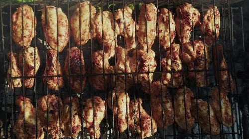 Chicken Wings Sizzling on Grill for Summer Barbecue
