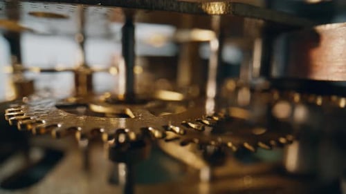 Intricate Clock Gears Turning in Time Close Up