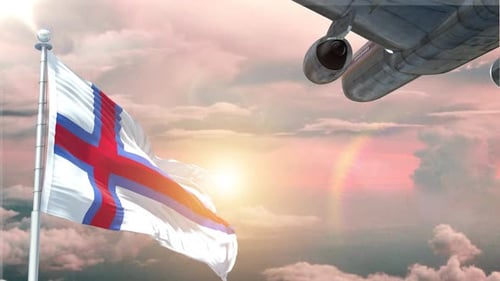 Waving Faroe Islands Flag and Airplane Flying in Sunset Sky