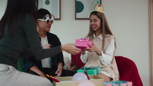 Friends Celebrating Birthday with Gifts at Home