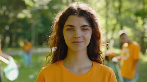 Young Woman Smiling During Community Park Clean Up
