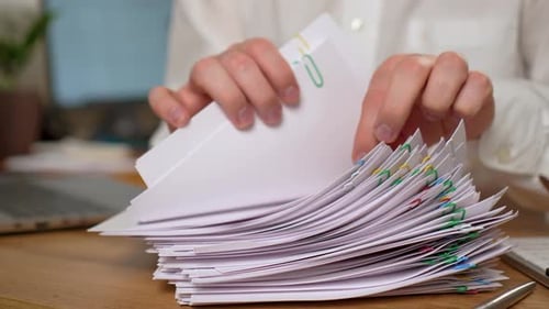 Businessman Searching Documents Lying on Table Business Report Papers Important Financial Documents